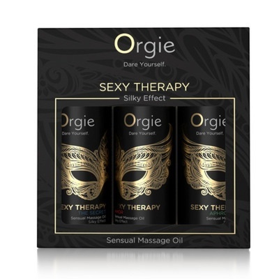 Caixa preta com três frascos de óleo de massagem Orgie Sexy Therapy com design de máscara dourada