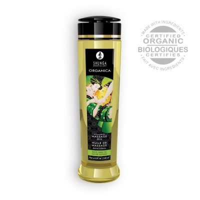 Frasco transparente amarelo de óleo de massagem com rótulo decorado e texto certificado orgânico