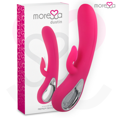 Vibrador cor-de-rosa com duas extremidades e detalhe prateado, ao lado da embalagem branca e rosa com o texto moresa dustin.