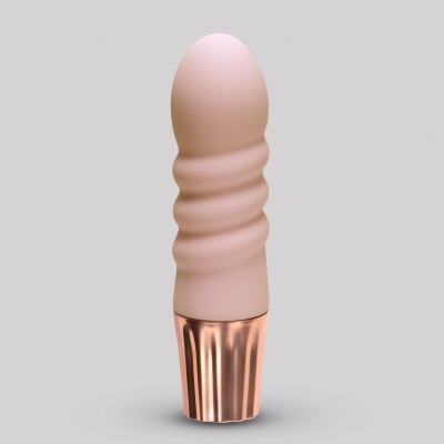 Objeto cilíndrico rosa claro com base metálica dourada