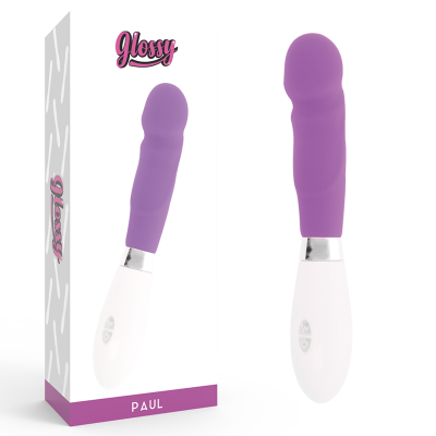 Vibrador roxo com base branca ao lado da sua embalagem etiquetada