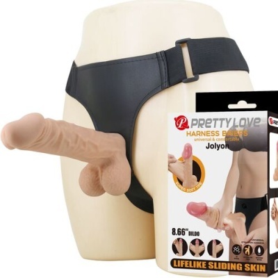 Cinta peniana preta com dildo realista e embalagem à direita