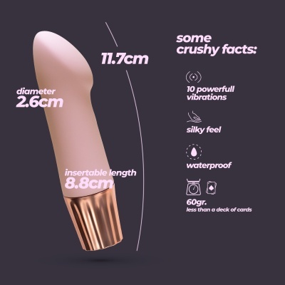 Vibrador cor de pele com base dourada e texto descritivo de dimensões e funcionalidades.