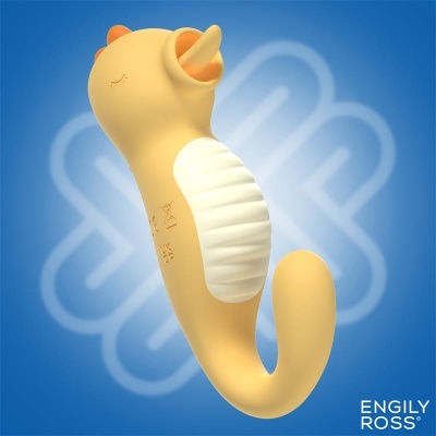 Brinquedo de silicone em forma de gato amarelo com barriga branca e orelhas laranja sobre fundo azul.