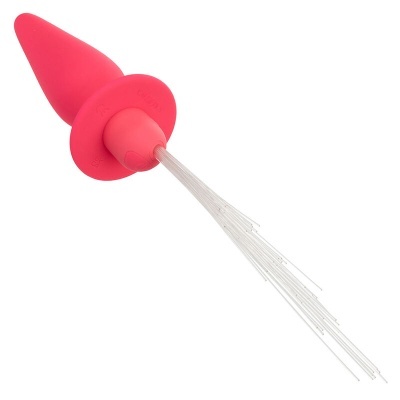Objeto rosa cónico com fios transparentes numa base branca