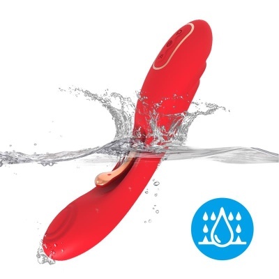 Vibrador vermelho à prova de água parcialmente submerso
