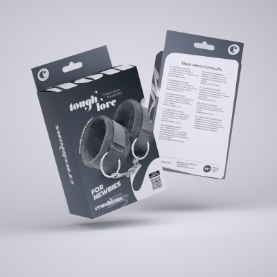 Embalagem preta com algemas de velcro pretas acolchoadas com corrente metálica e texto multilíngue no verso