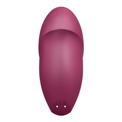 Objeto oval roxo com botões metálicos e símbolos CE e de lixo comum