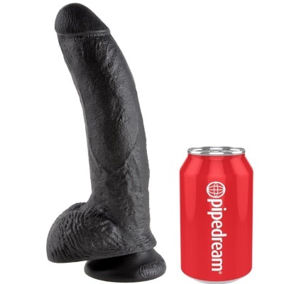 Dildo preto realista ao lado de uma lata vermelha com texto branco pipedream