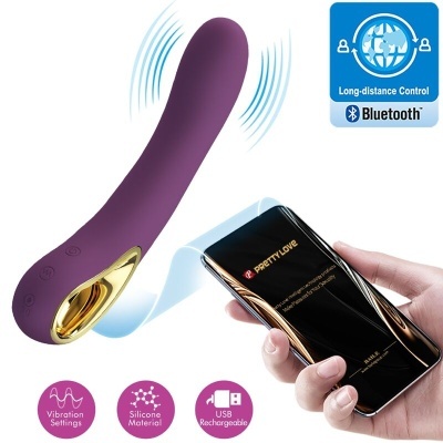 Vibrador roxo em silicone com detalhes dourados e controlo por telemóvel via Bluetooth