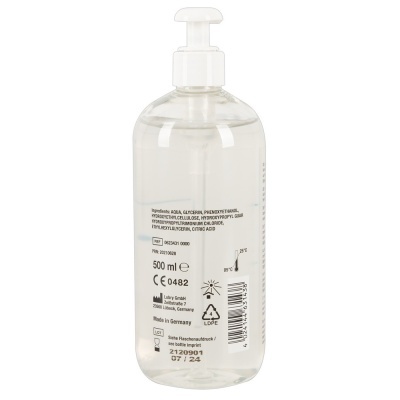 Frasco transparente com doseador branco e rótulo com texto e símbolos