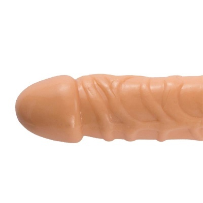 Produto em forma de falo bege com textura veias, superfície lisa