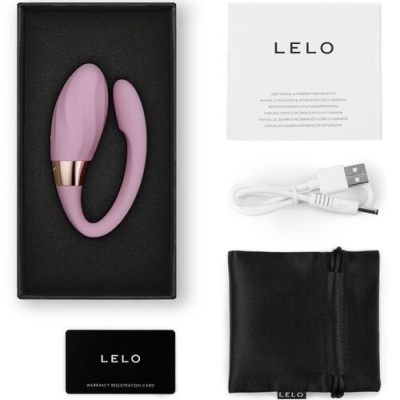 Produto pessoal em silicone rosa com acessórios e manual da marca LELO