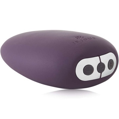 Dispositivo eletrônico arredondado roxo com botões e inscrição JE JOUE