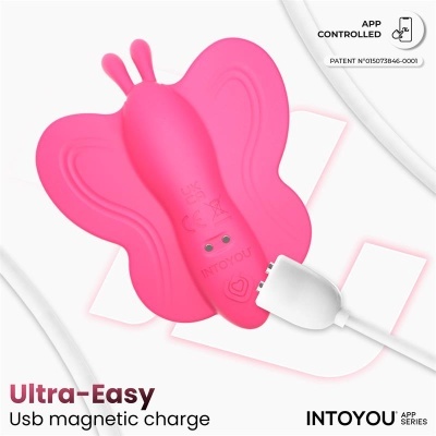 Vibrador rosa em forma de borboleta com carregamento magnético USB.