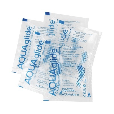 Saquetas transparentes de lubrificante médico AQUAglide com texto azul