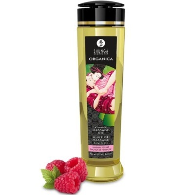 Frasco de óleo de massagem amarelo com tampa preta e framboesas ao lado