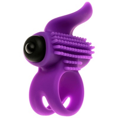 Anel vibratório roxo com textura de cerdas e botão preto em fundo branco