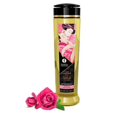 Frasco dourado e preto de óleo de massagem erótico com rótulo floral e rosas cor-de-rosa.