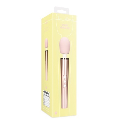 Embalagem amarela com vibrador tipo varinha rosa e dourado e texto amarelo