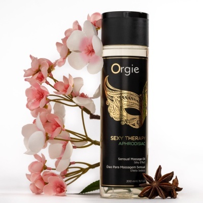 Frasco de óleo para massagem sensual Orgie com flores cor-de-rosa e anis-estrelado