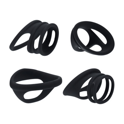 Conjunto de quatro anéis pretos de silicone com designs ocos