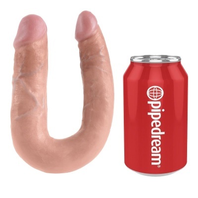 Produto em forma de U com duas pontas cor de pele ao lado de uma lata vermelha com a palavra Pipedream.