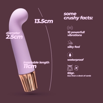 Vibrador lilás de silicone com base dourada e informações técnicas