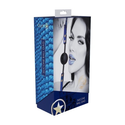Embalagem azul com padrão escamoso e imagem de mulher a preto e branco com brinquedo de bola de silicone