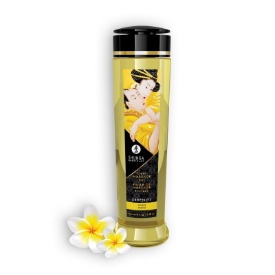 Frasco amarelo translúcido de óleo de massagem erótica com tampa preta e rótulo com arte japonesa e flores ao lado