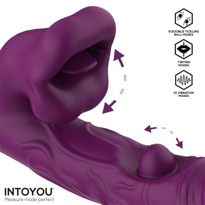 Produto vibrador roxo em silicone com esfera móvel e parte em forma de lábio