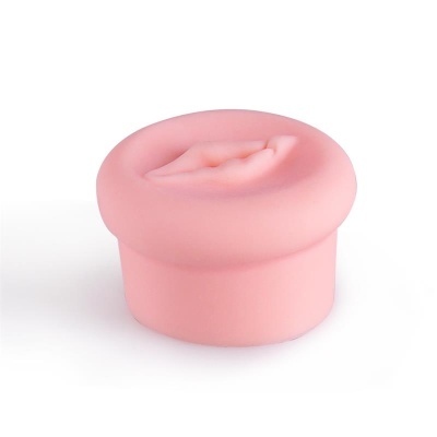 Produto de silicone cor de rosa arredondado com abertura central texturizada