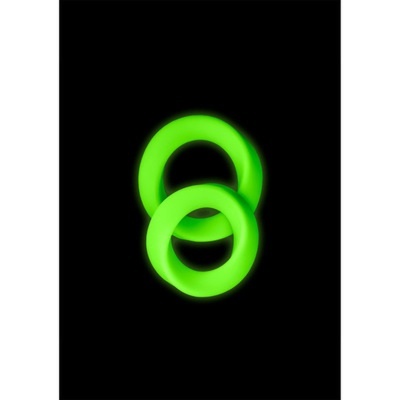 Dois anéis fluorescentes verdes sobre fundo preto
