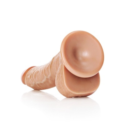 Dildo cor pele com base de ventosa em superfície branca