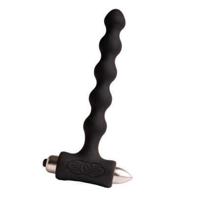 Produto sexual preto de silicone ondulado com base retangular e detalhe metálico