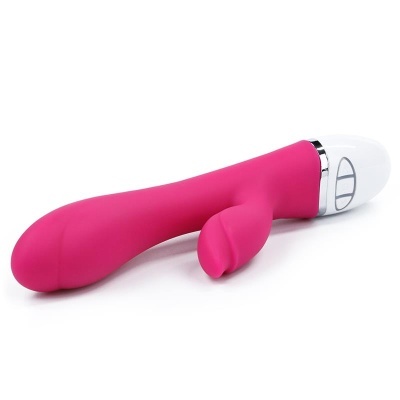 Vibrador cor-de-rosa com comandos na base sobre fundo branco