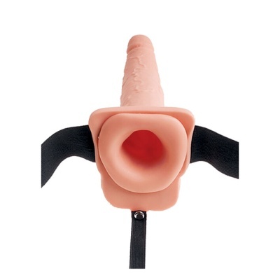 Produto simulando forma fálica em silicone cor pele com alças pretas ajustáveis