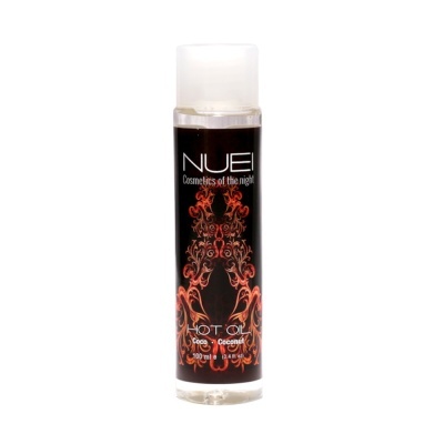 Frasco de óleo quente de coco NUEI com rótulo preto e detalhe ornamental laranja
