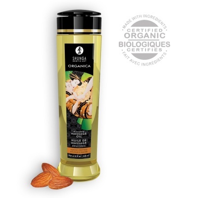 Frasco de óleo de massagem Shunga Organica amarelo com tampa preta e amêndoas
