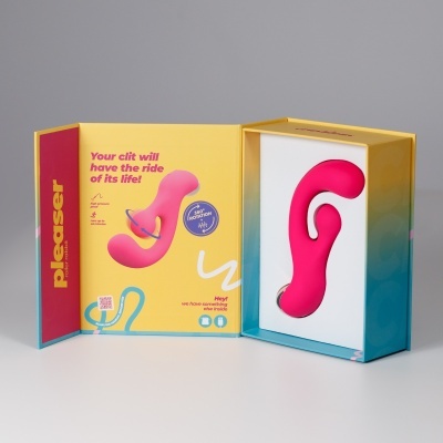 Dispositivo vibrador rosa em embalagem amarela e azul com texto em inglês