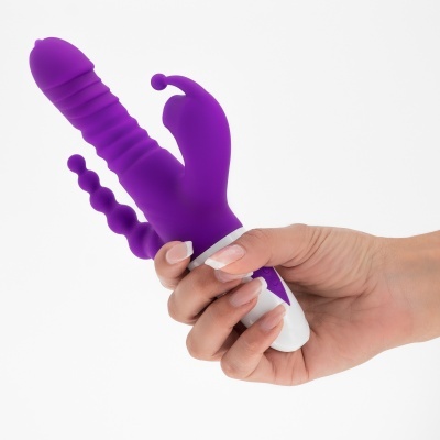 Vibrador roxo de silicone com texturas em fundo branco