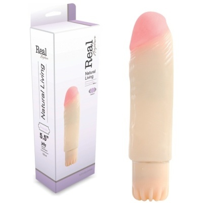 Vibrador Real Mystique Natural Living de cor pele com ponta rosa e embalagem branca ao lado