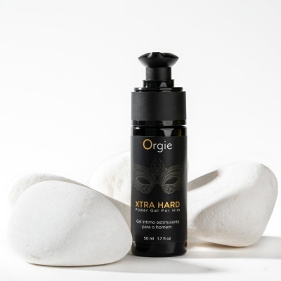 Frasco preto de gel estimulante masculino com texto e pedras brancas lisas