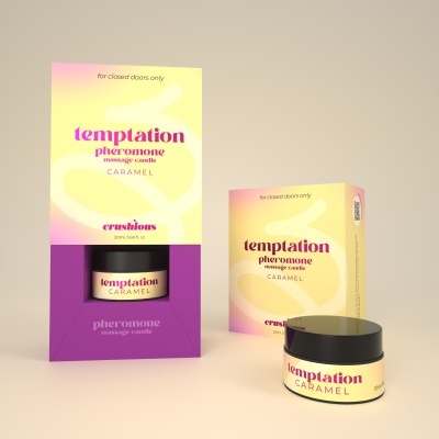 Embalagem amarela e rosa de vela de massagem pheromone e frasco preto pequeno