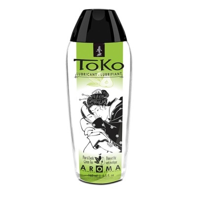Frasco de lubrificante Toko com etiqueta verde e ilustração oriental.