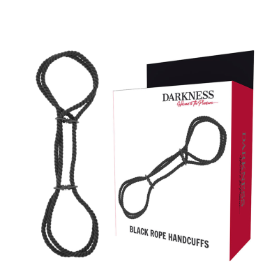Algemas de corda preta ao lado da embalagem com texto DARKNESS Welcome to the Pleasure e BLACK ROPE HANDCUFFS