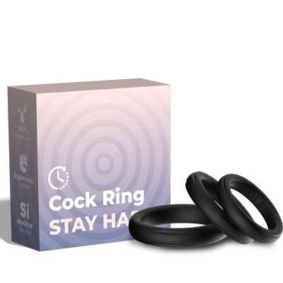 Caixa e dois anéis cockring negros em silicone com texto e símbolos na embalagem