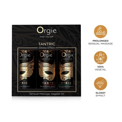 Pack de três óleos para massagem Orgie Tantric em embalagem preta com máscara dourada.