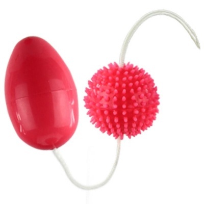 Duas peças plásticas vermelha e rosa ligadas por um cordão branco.
