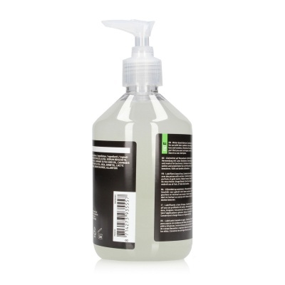 Frasco transparente de plástico com dispensador e rótulo preto multilíngue